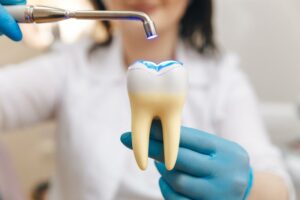 Dentist shining light on tooth filling.