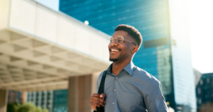 a smiling businessman with glasses